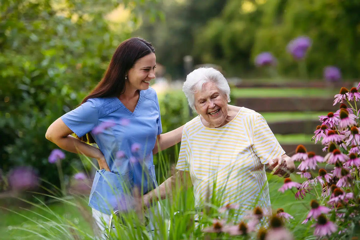 Winnipeg caregiver walking outdoors with an older adult receiving personalized memory care