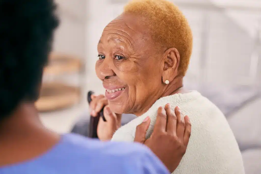 Caregiver reassuring an older adult during compassionate dementia care in Winnipeg