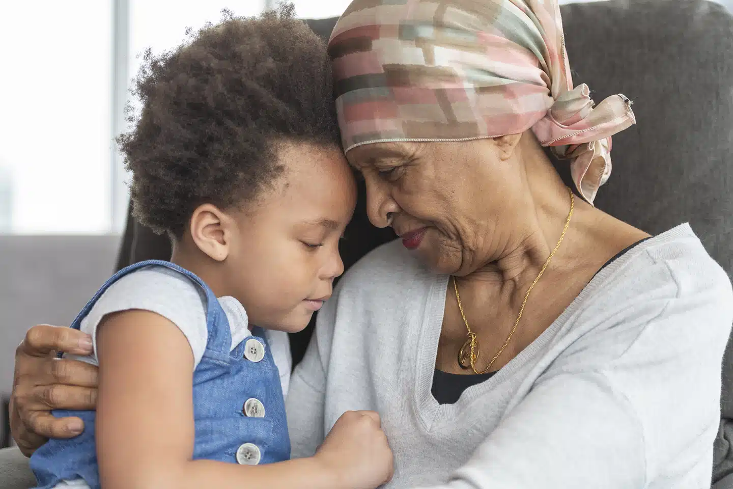 Senior woman spending time with her grandchild while receiving private home care services in Winnipeg
