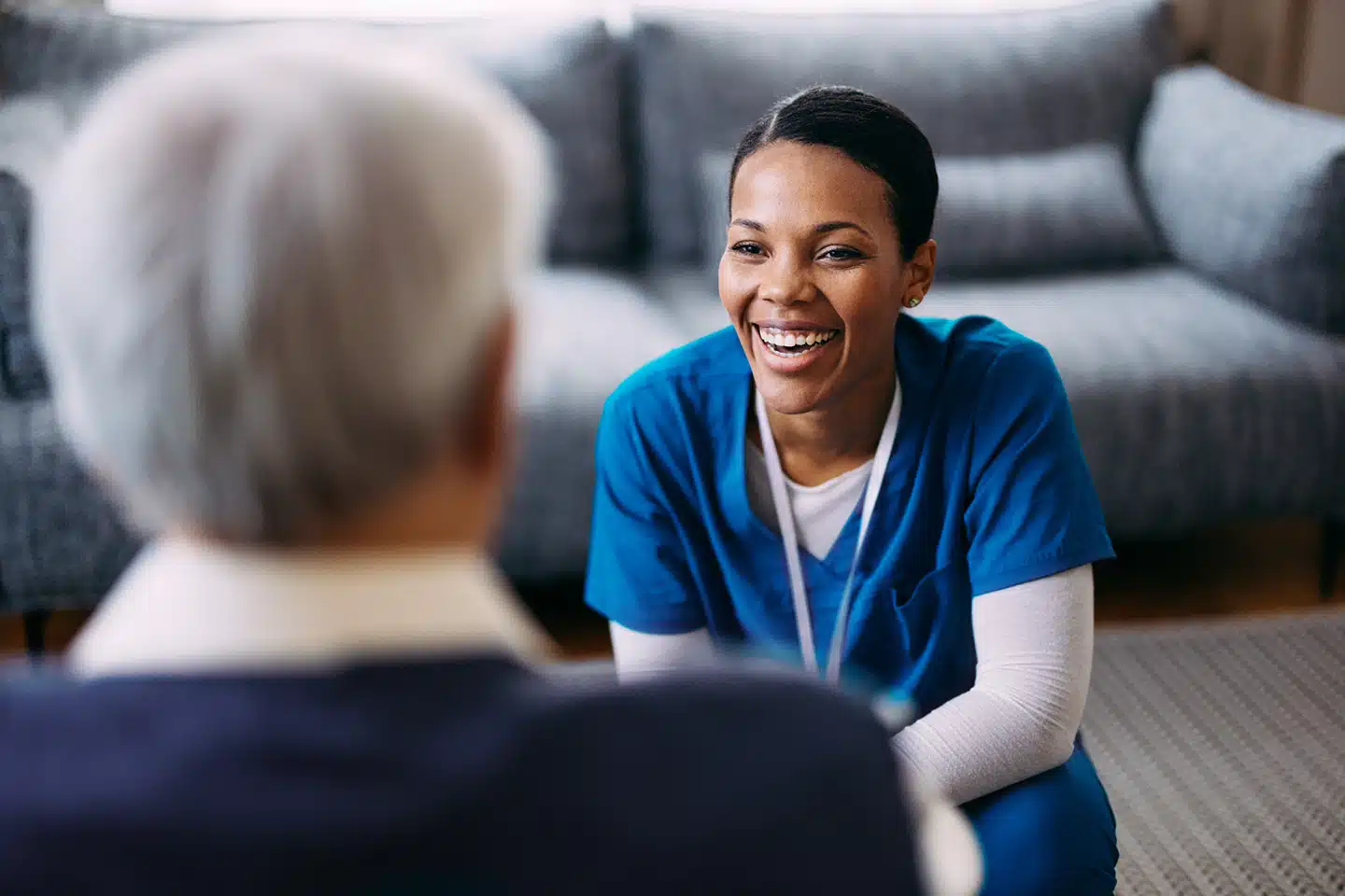 Winnipeg caregiver speaking with an older adult during personalized palliative home care services