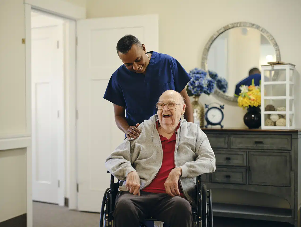 Caregiver assisting a senior in a wheelchair during comfort care in Winnipeg